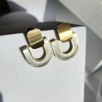 Σκουλαρίκια Κουμπωτά U- Δίχρωμο