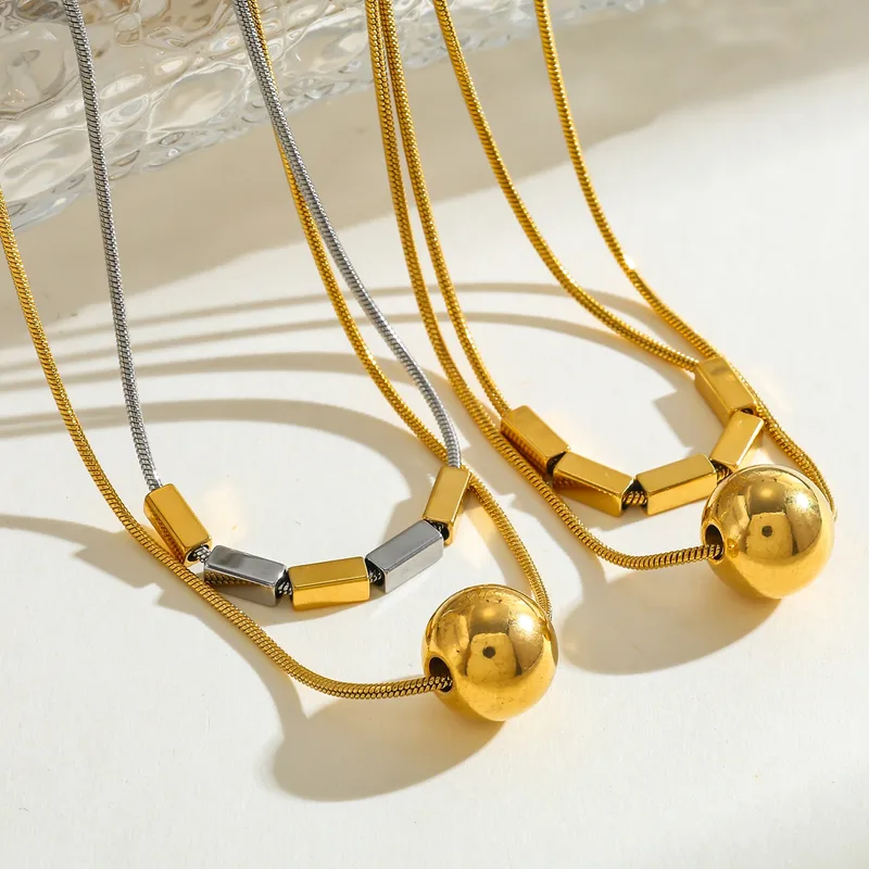 gunaikeio-kolie-atsalino-xriso-asimi-kosmima-online (17) Κολιέ Διπλή Αλυσίδα Bar and Sphere - Δίχρωμο - Image 1