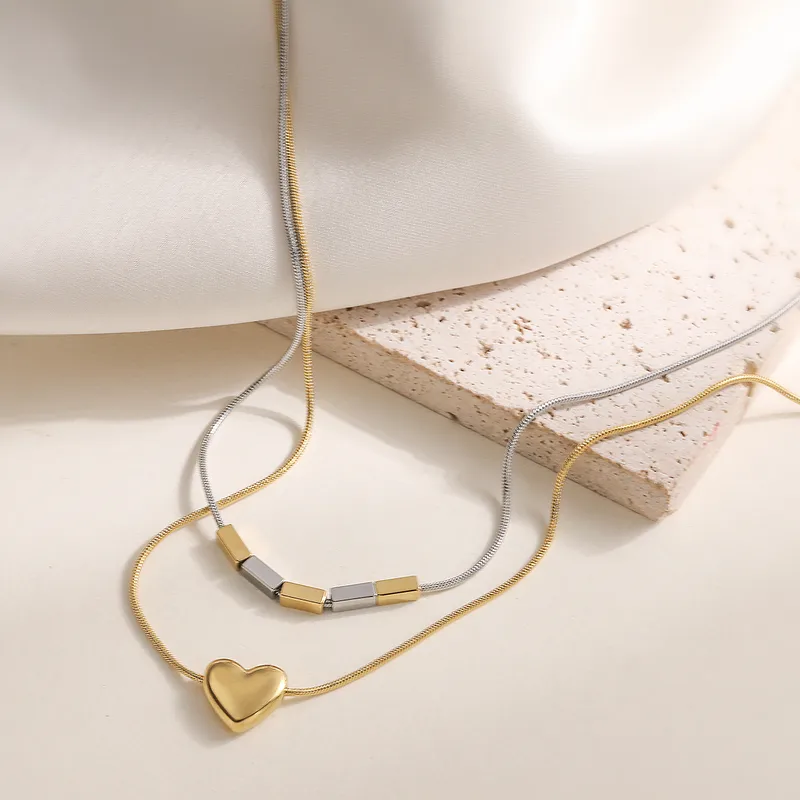 gunaikeio-kolie-atsalino-xriso-asimi-kosmima-online (52) Κολιέ Διπλή Αλυσίδα Καρδούλα με Ράβδους - Δίχρωμο - Image 1