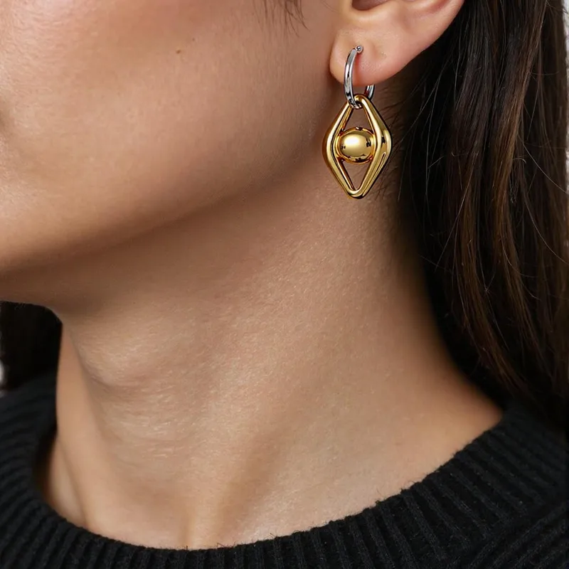 skoularikia-gunaikeia-kosmima-online-atsalina-dixrwma-xrisa-asimi (76) Σκουλαρίκια Κρικάκια Eye Drop - Δίχρωμο - Image 1